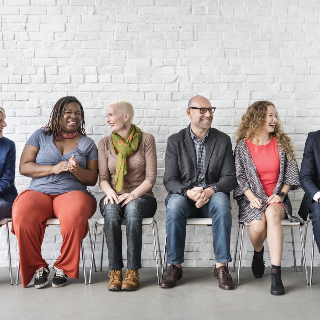 Diverse Group of People Community Togetherness Sitting Concept